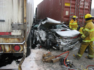Crushed between 2 trucks