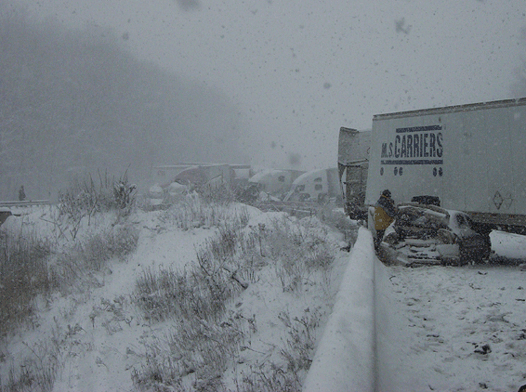 Truck Crushes Car in Highway Crash