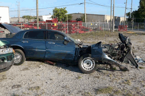 Crashed Lincoln Town car