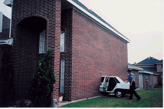 Car crashed into brick wall