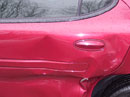 Dented red car