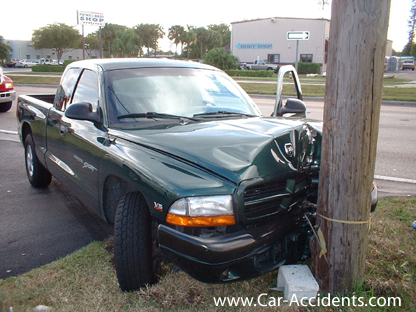 Dodge Dakota Accident Note Body Shop in Background.